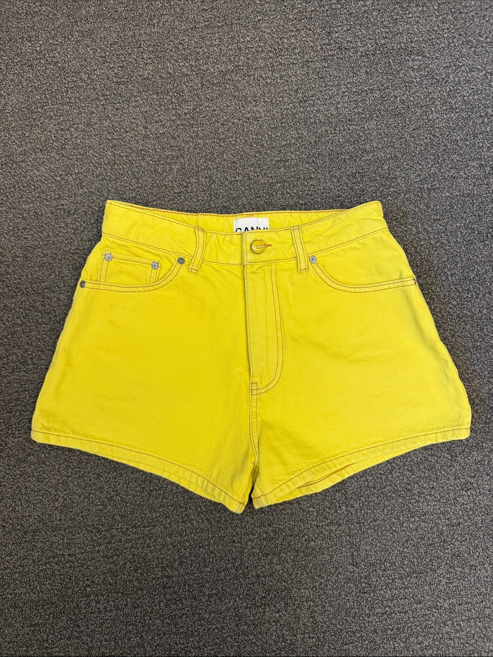 GANNI Overdyed High-Rise Denim Shorts in Blazing Yellow